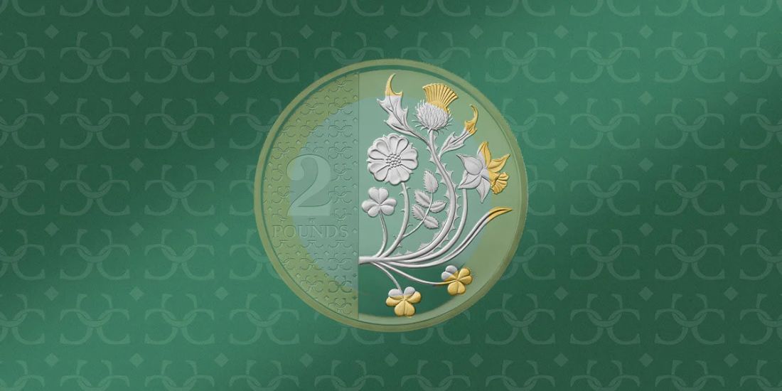 Pièce britannique de 2 livres ornée des fleurs emblématiques des quatre nations du Royaume-Uni