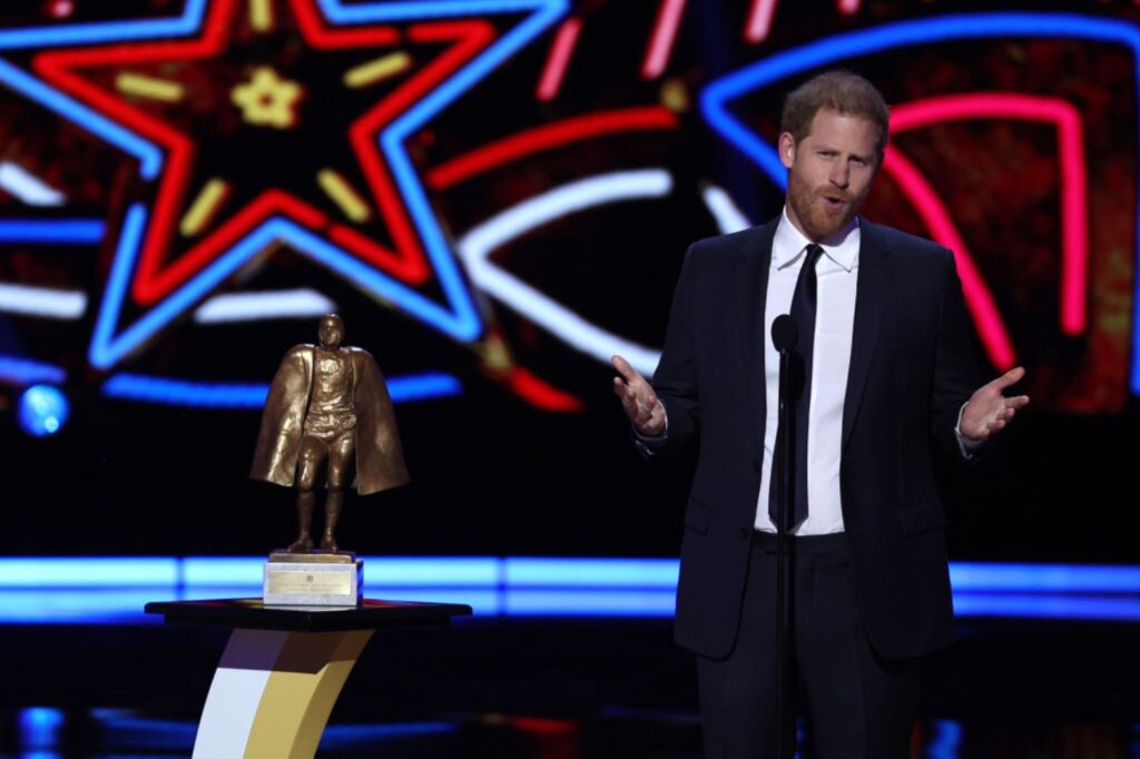 Prince Harry is pictured on stage at NFL Honors to present an award