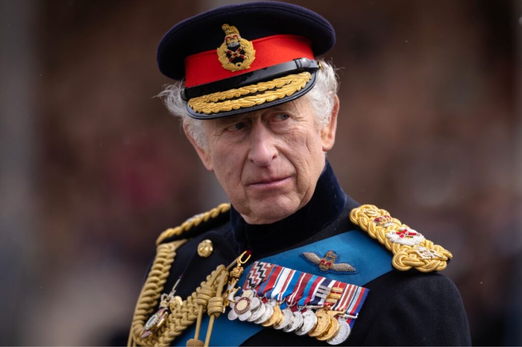 King Charles pictured in his military uniform as he attends a parade in Camberley, England