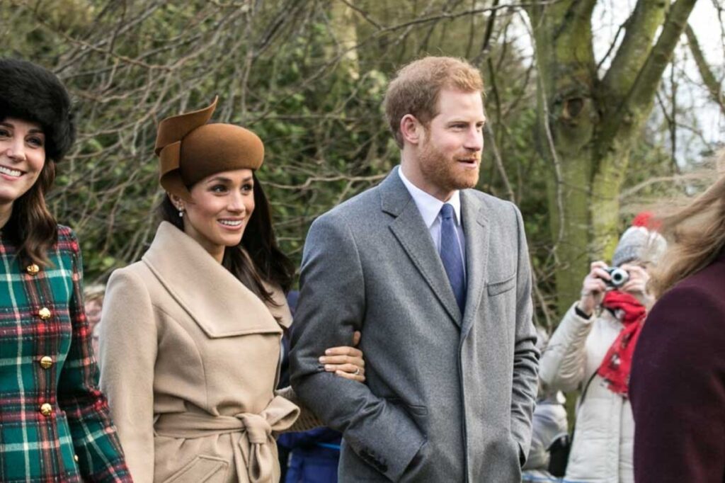 Prince Harry and Meghan Markle pictured in long coats during a winter outing