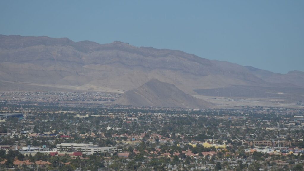 A view of Lone Mountain in Las Vegas, Nevada, with many buildings and homes around it.