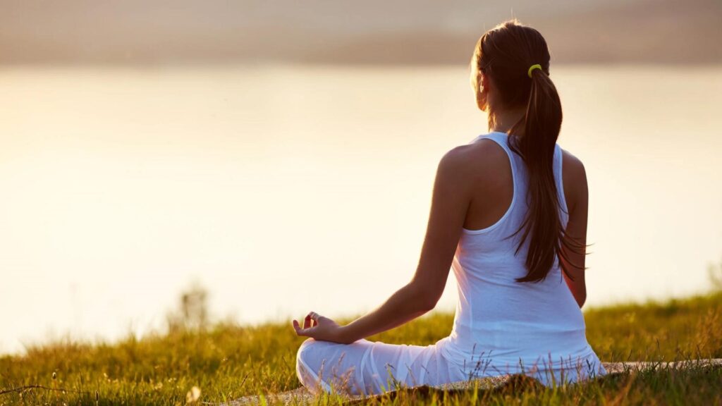 Rear View of Woman Meditating Outdoor