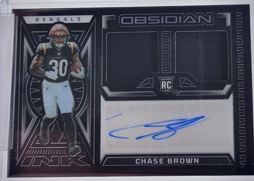 Chase Brown #34 Football Cards 2023 Panini Obsidian Rookie Jersey Ink