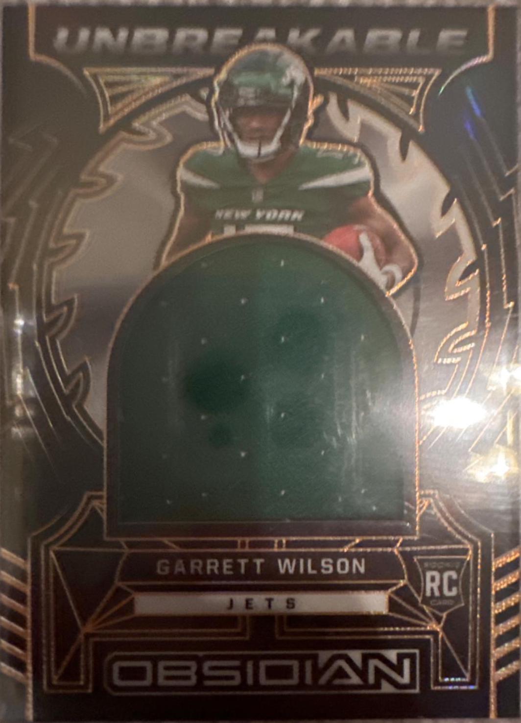Garrett Wilson #UM-GWI Football Cards 2022 Panini Obsidian Unbreakable Material