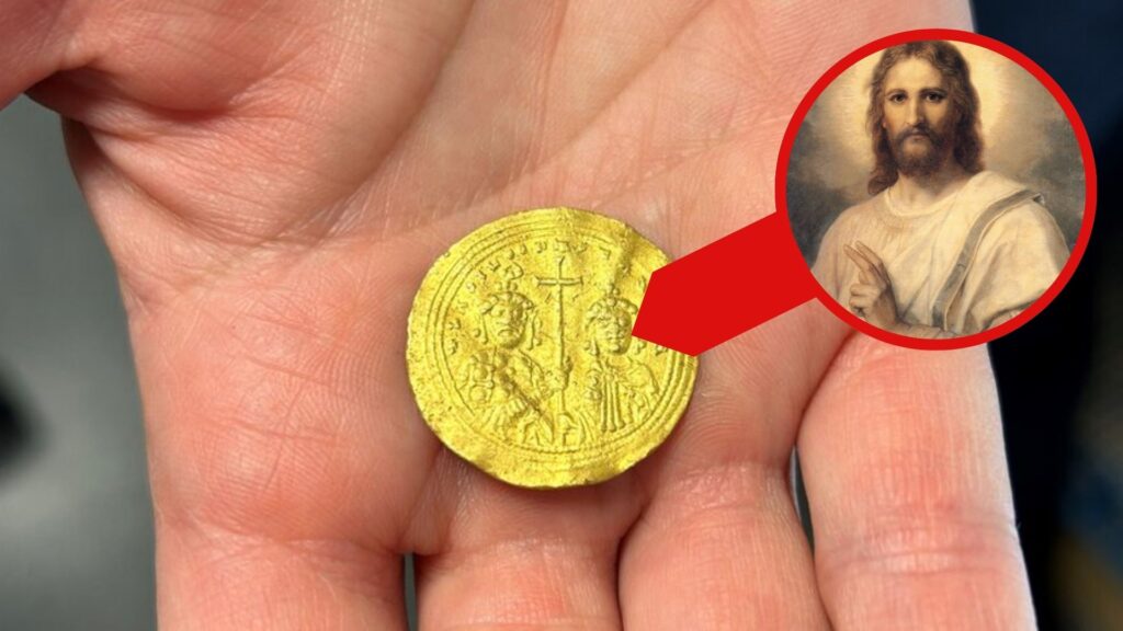 Gold byzantine coin in hand