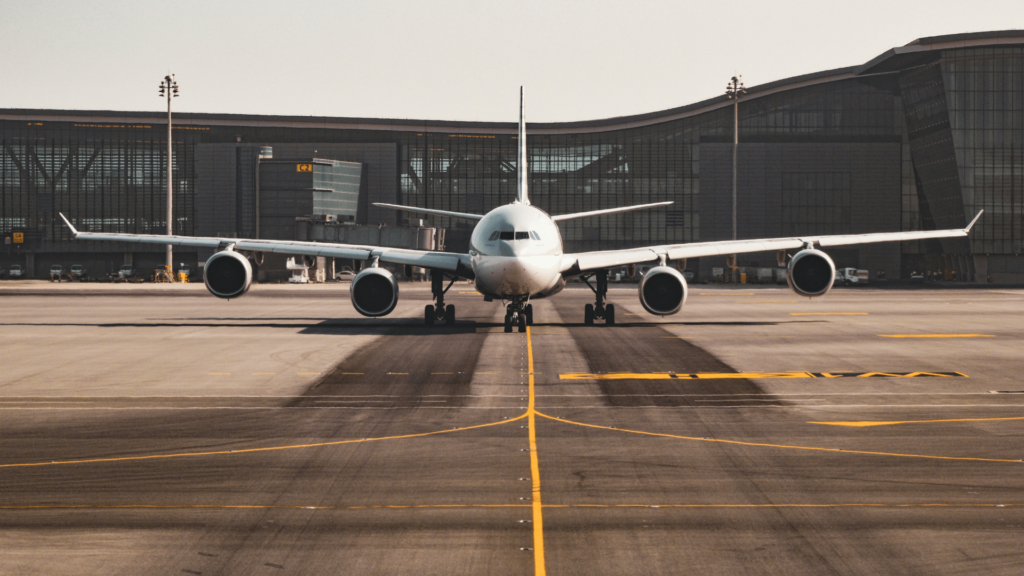 A commercial airliner prepares for takeoff on a runway.