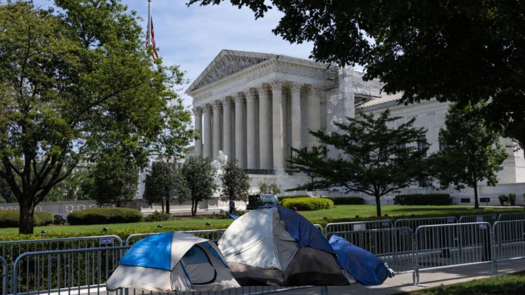 Supreme Court exterior with tents outside of it