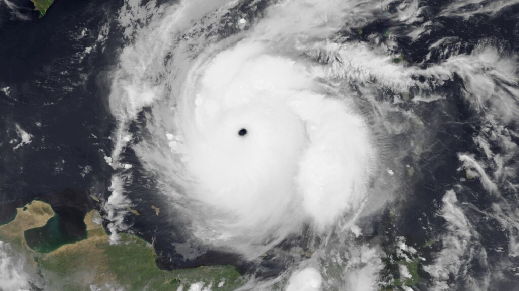 An aerial view of Hurricane Beryl near land.