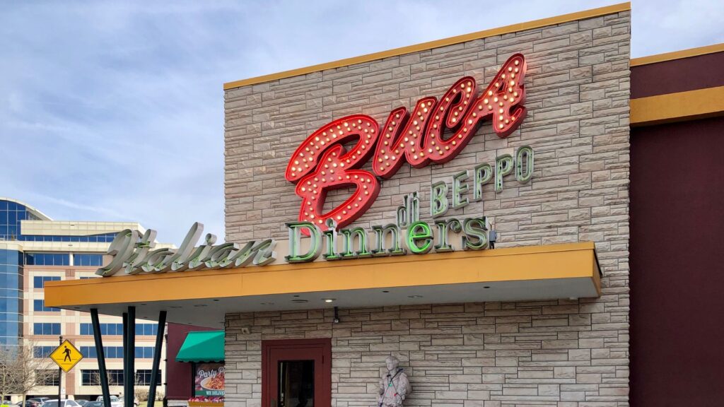 An exterior view of a Buca di Beppo restaurant seen in the daytime.