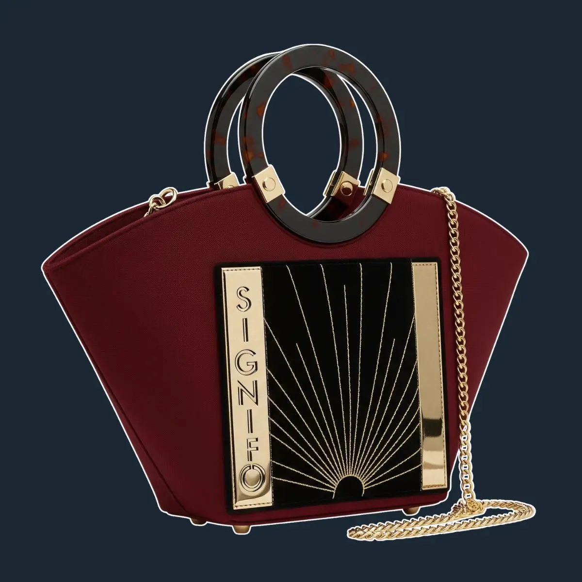 Tas Art Deco kanvas marun dengan detail emas.