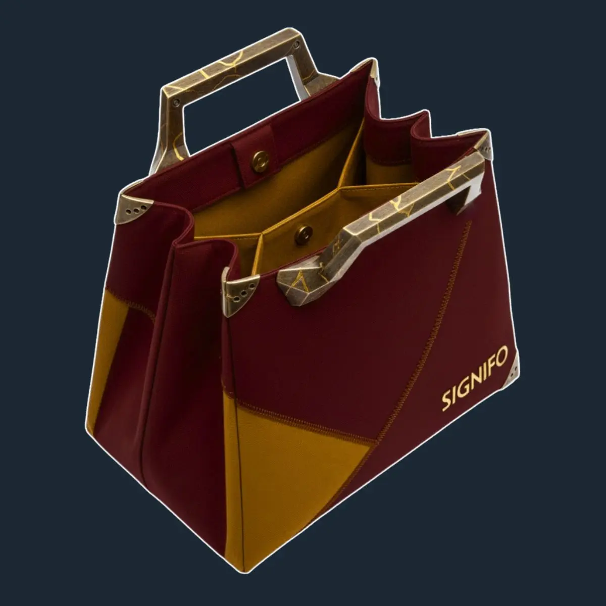 Tote Crimson Labyrinth merah mustard dengan pegangan logam.