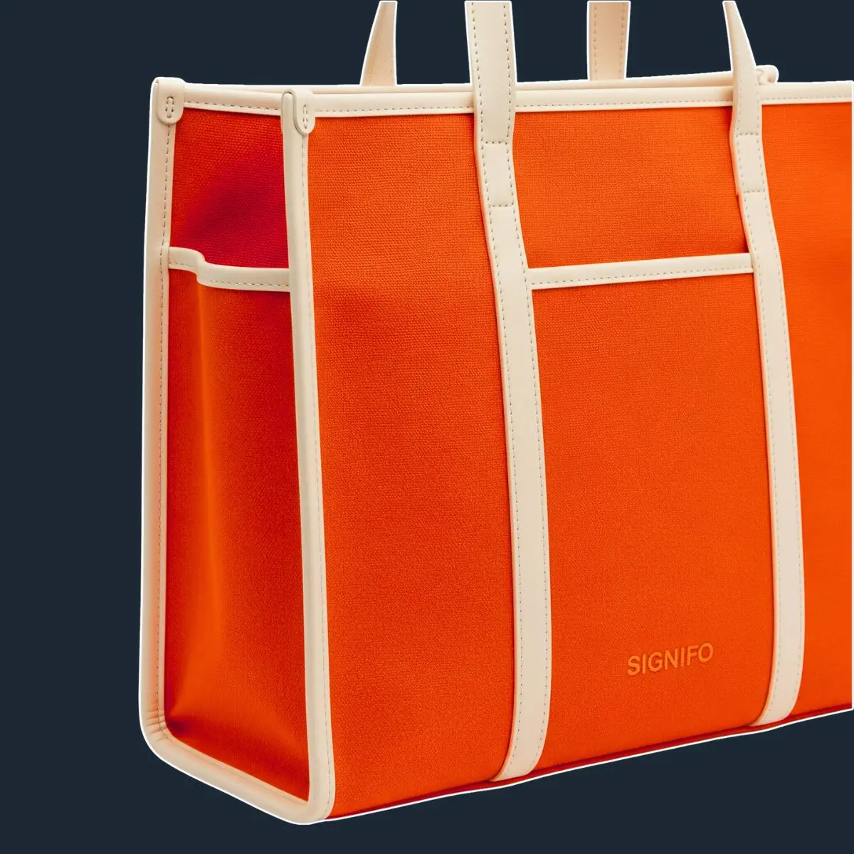 Tote oranye besar dengan trim krem dan kantong luar.