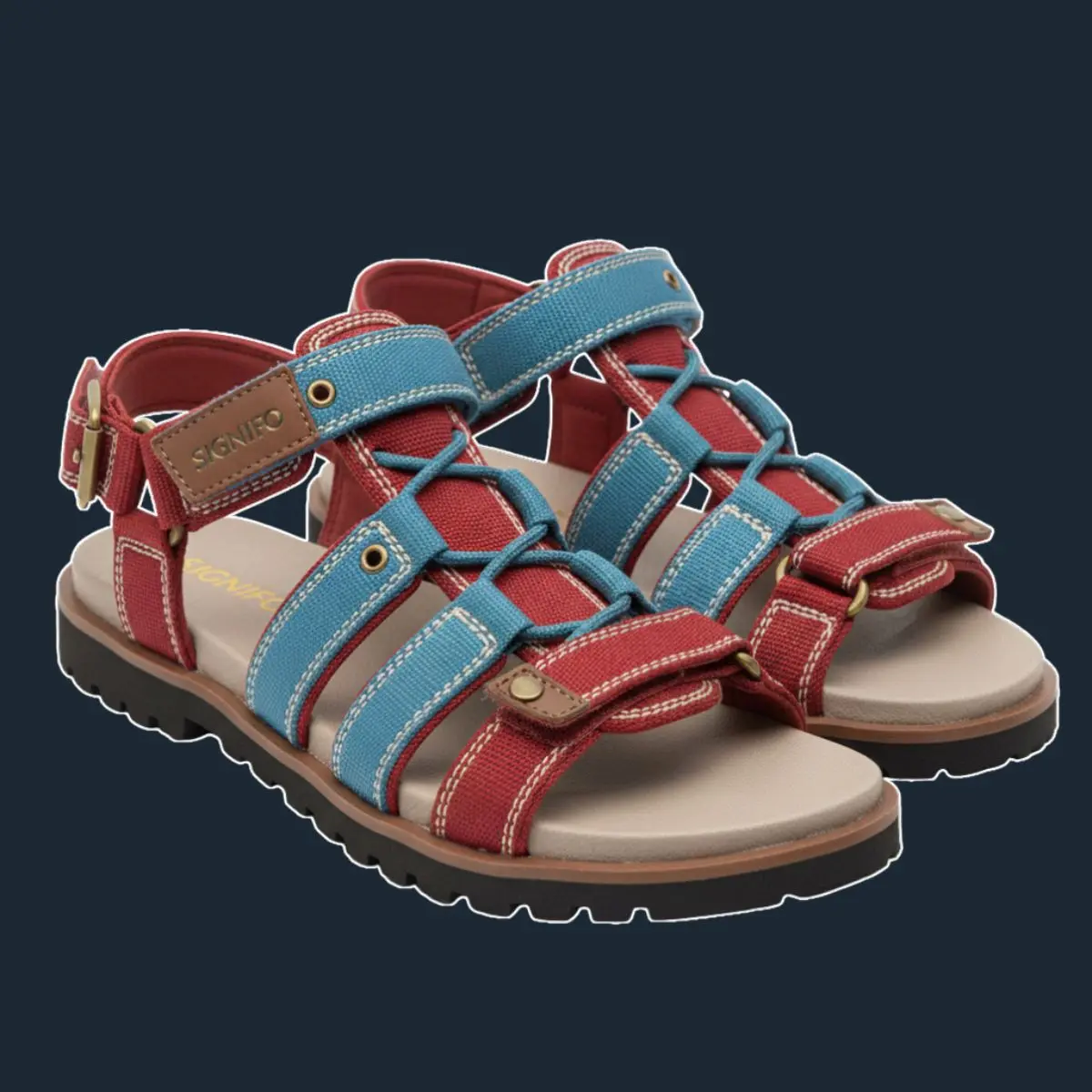 Sepasang sandal Signifo merah-biru dengan tali silang.