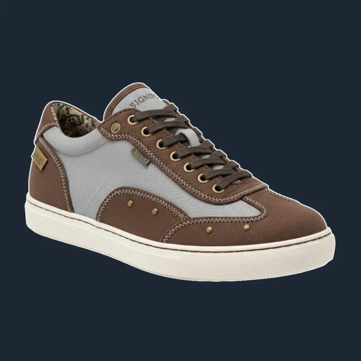 Sneaker retro abu-abu pastel dengan panel cokelat dan kancing kuningan.