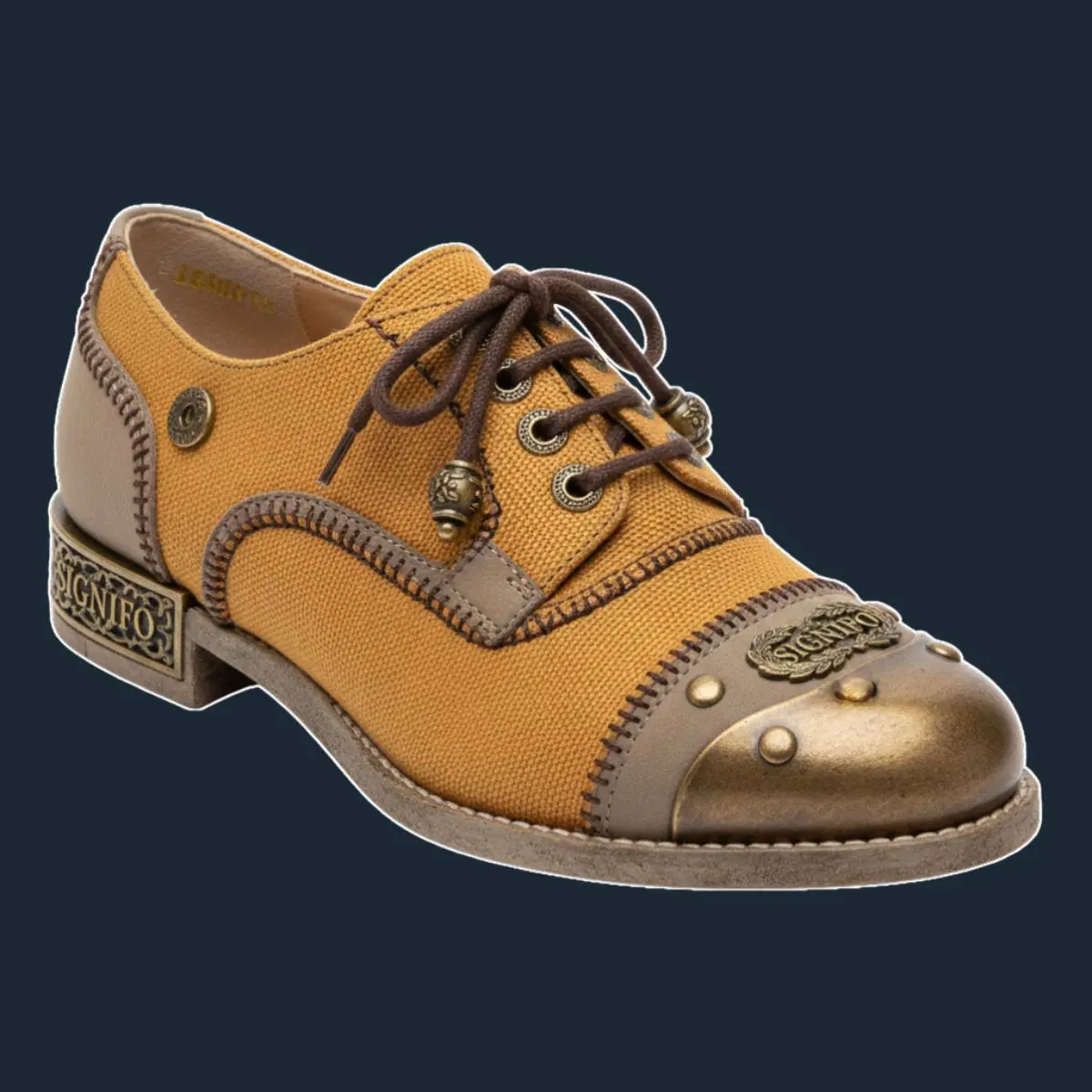 Sepatu brogue oker emas dengan pelindung logam kuningan.