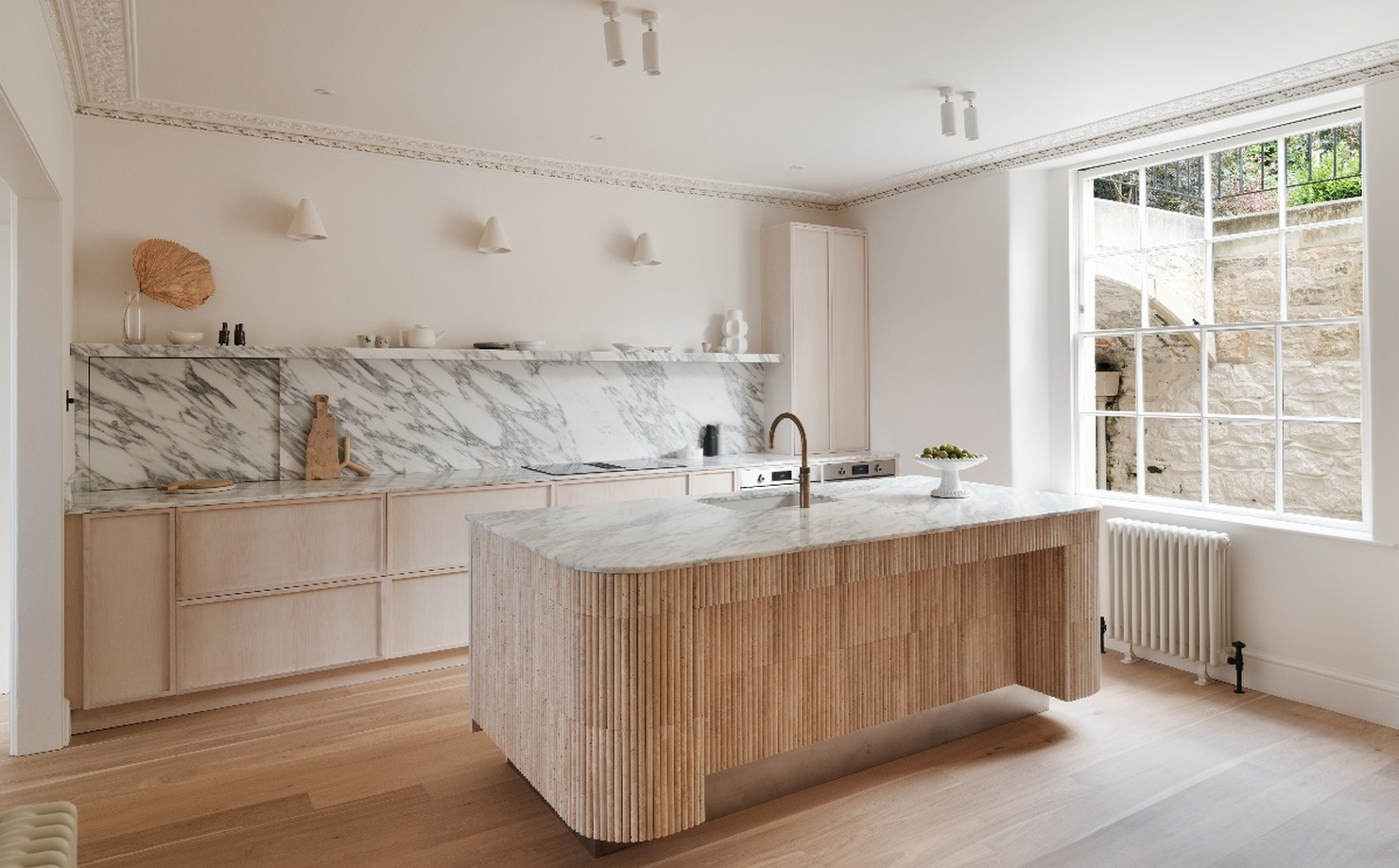 A Minimalist Kitchen Layered With Warm Wood and Stone