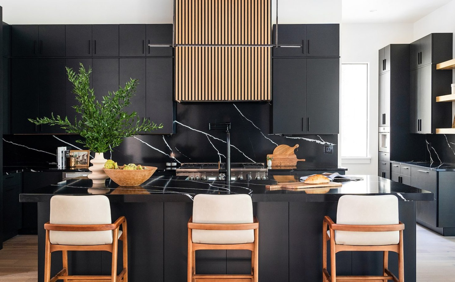 Warm Modern Kitchens With Dark Cabinetry and Natural Materials