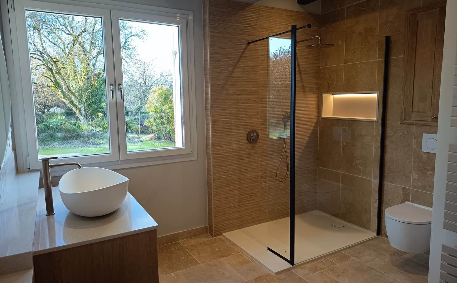 Travertine and Oak Bathrooms With Concealed Storage