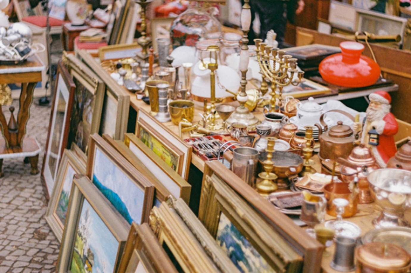 A flea market stall filled with vintage and antique items