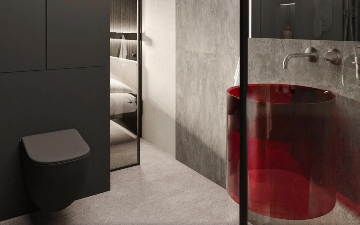 Dark gray and concrete bathroom accented by red