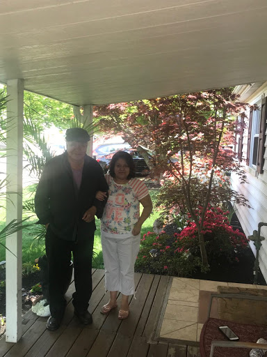 Young girl with her father on a porch