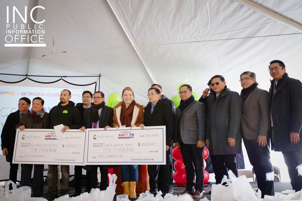 Tom Casey of KILI Radio and Isabel Stadnick of the Lakota Waldorf School both accepting their respective donations of $10,000 for their work in the Kyle, SD community. Donation from the Felix Y. Manalo Foundation presented by INC General Auditor Brother Glicerio Santos, Jr. and Ministers of the Gospel from the region.