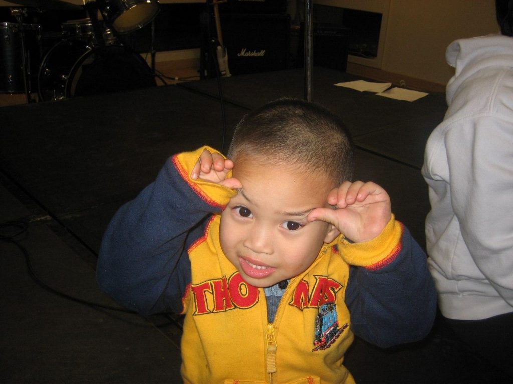 Little boy making faces at camera