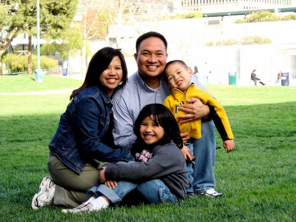 Family of four in the middle of a park