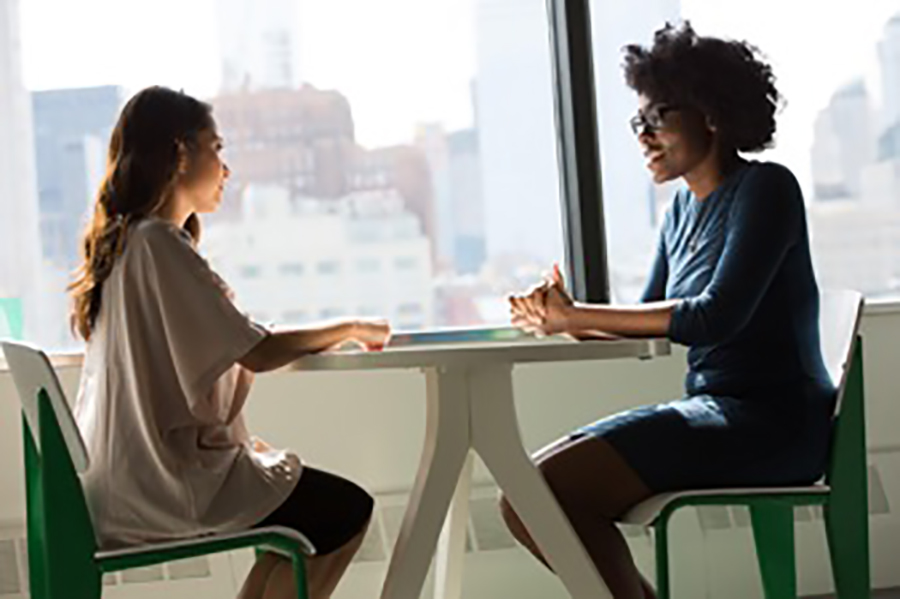 Two women talking
