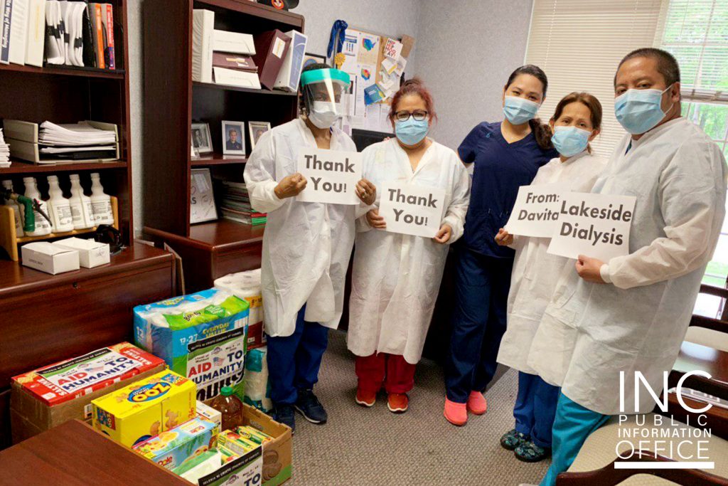 Staff from Davita Lakeside Dialysis Center accept food and hygiene supplies donations from the FelixY. Manalo Foundation. 