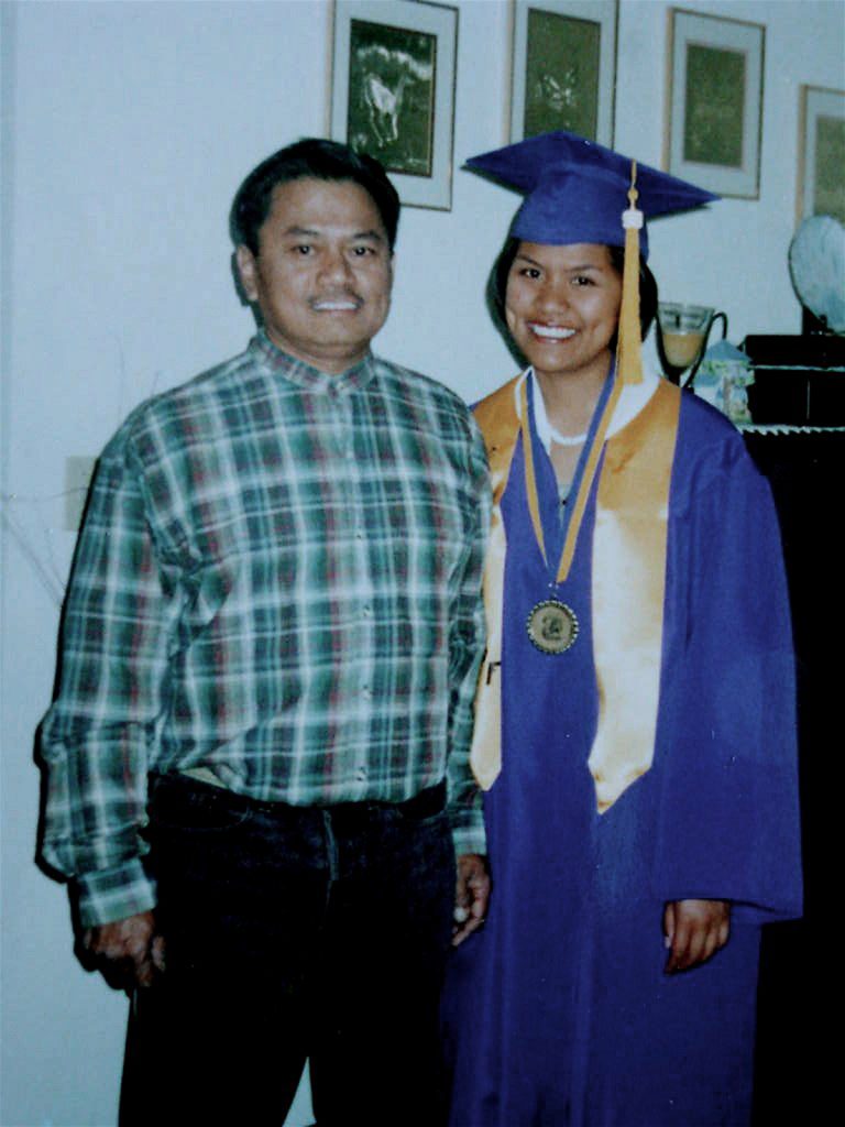 Renezen as a high school graduate with dad.