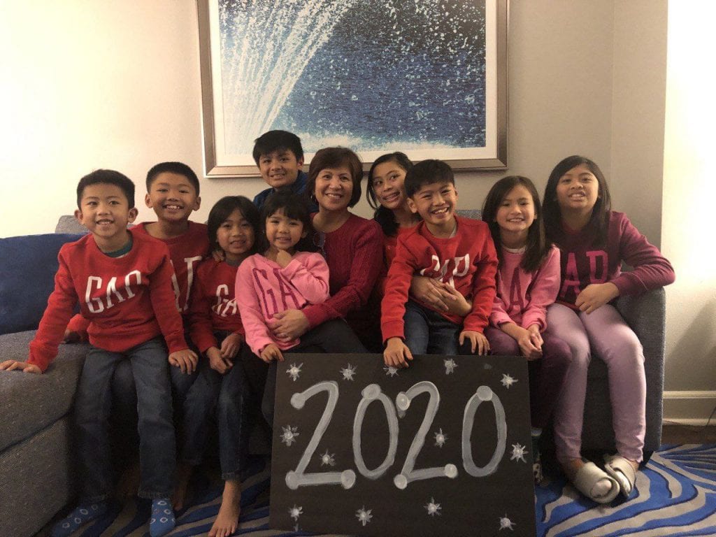 Grandkids with grandma and a 2020 sign.