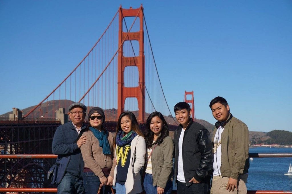 Krista with family in front of Golden Gate Bridge