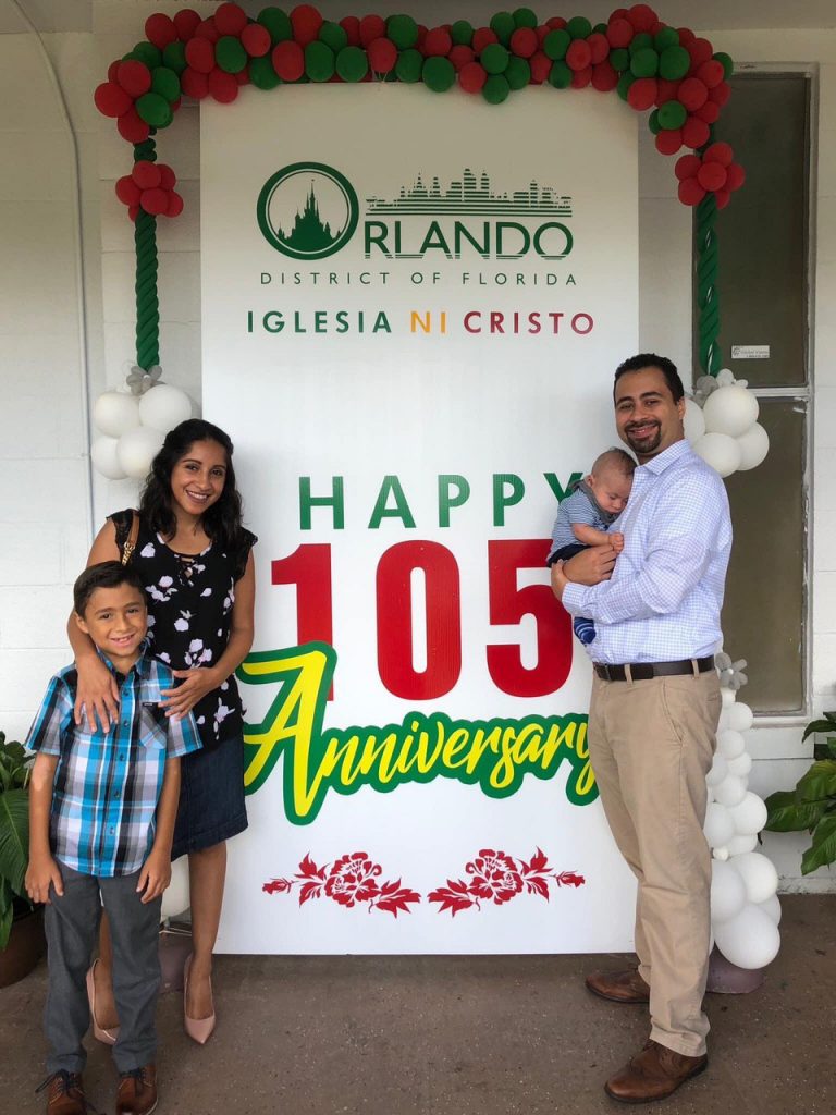 Family of four with a 105th sign.