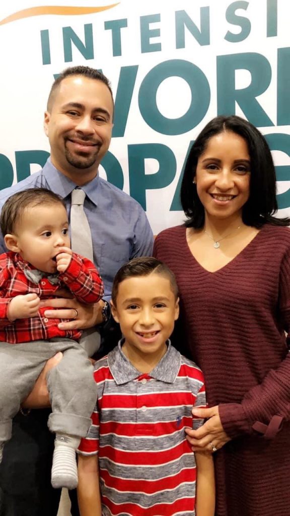 Family of four smiling at church.