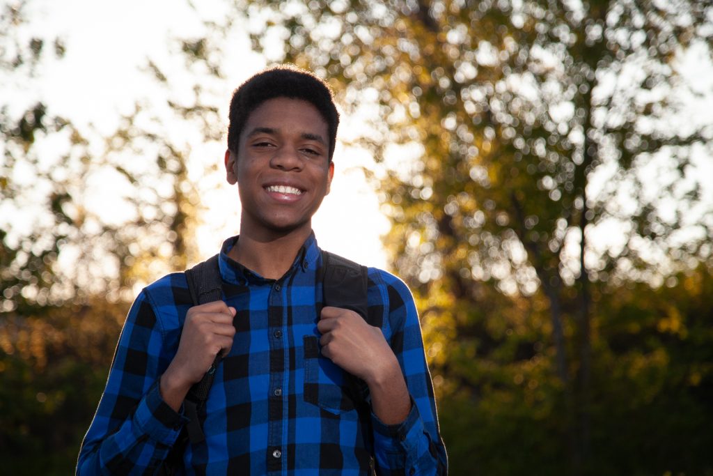 Smiling Young Man Backpack Outdoors