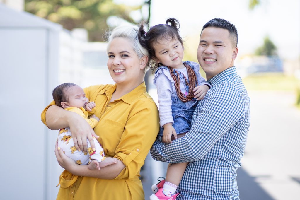 family photo posing outside