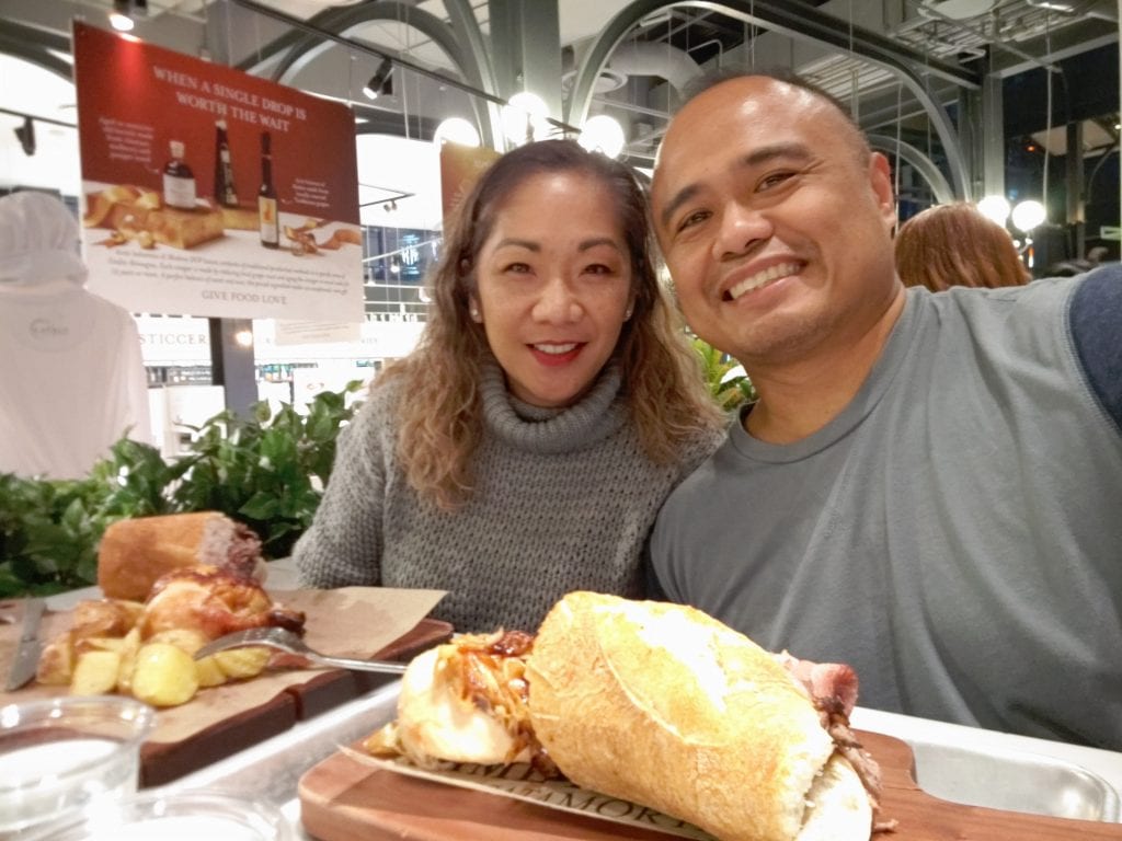 Married couple at a restaurant with food