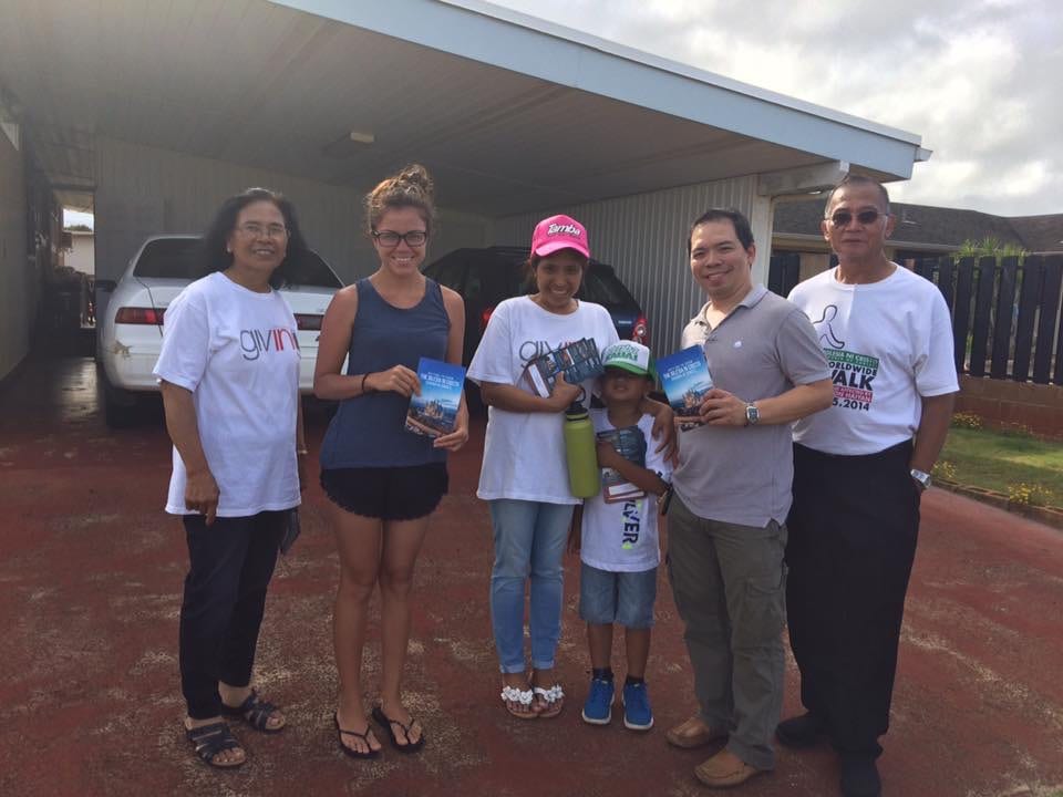 Bruce with a group of people handing out God's Message magazines