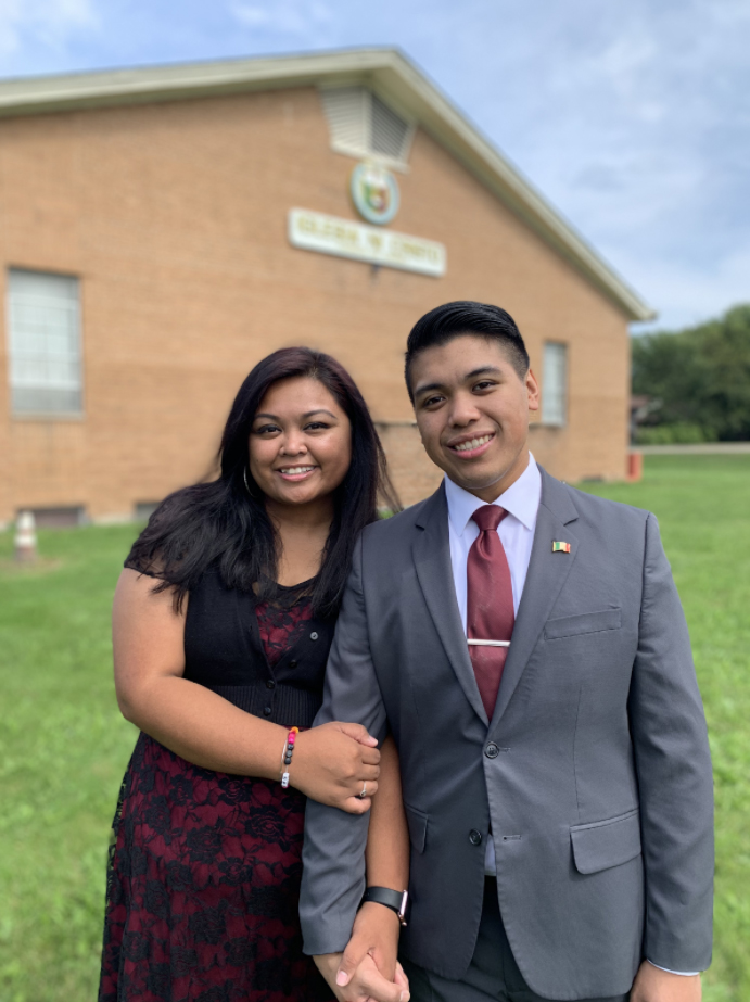 Couple standing in front of chapel
