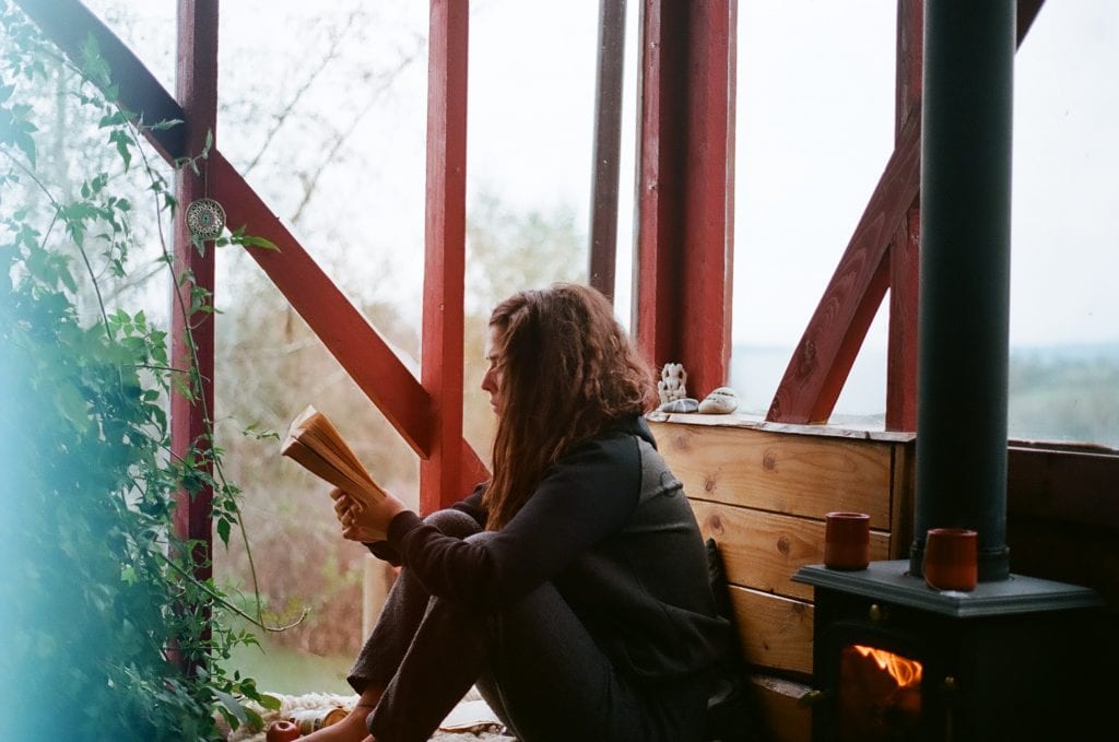 WOMAN READING ON THE FLOOR