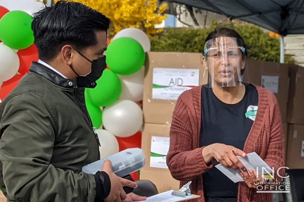 Outside INC’s Greater Toronto District Office, Seema David, wearing a face shield, expresses in an interview her appreciation for Brother Eduardo V. Manalo’s “very kind directive in providing support to 5n2 Kitchen” after she had reached out to him for assistance.