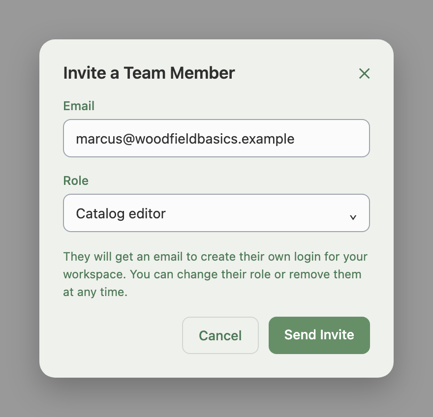 Invite a Team Member window with Email set to marcus@woodfieldbasics.example and Role set to Catalog editor