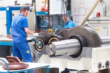 Can surface coatings improve the overall efficiency of gearboxes by reducing friction and heat generation?