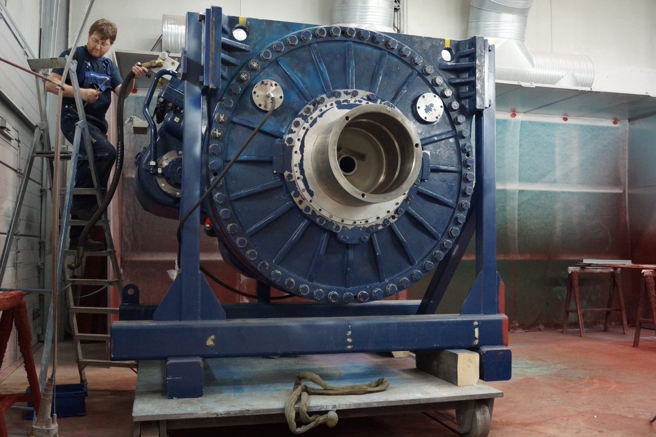 What are the benefits of using carburizing for gear housing surface hardening?