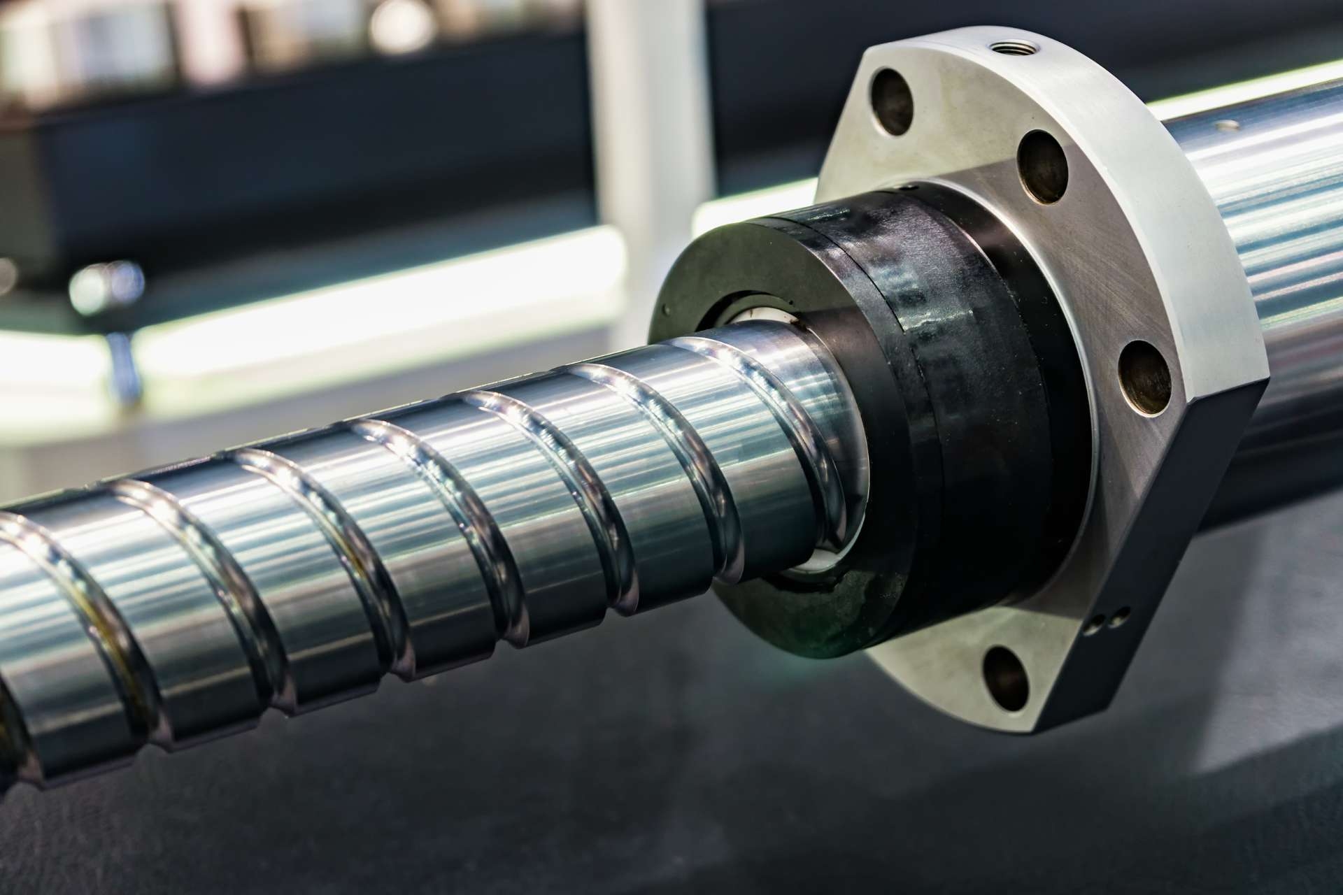 How does the manufacturing process for gearbox housing materials differ between metals, plastics, and composites?