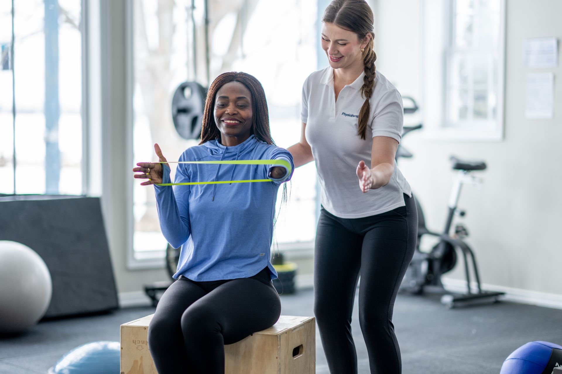 Is it necessary to seek professional help, such as a physical therapist, for the rehabilitation of iliotibial band syndrome, or can it be done independently?