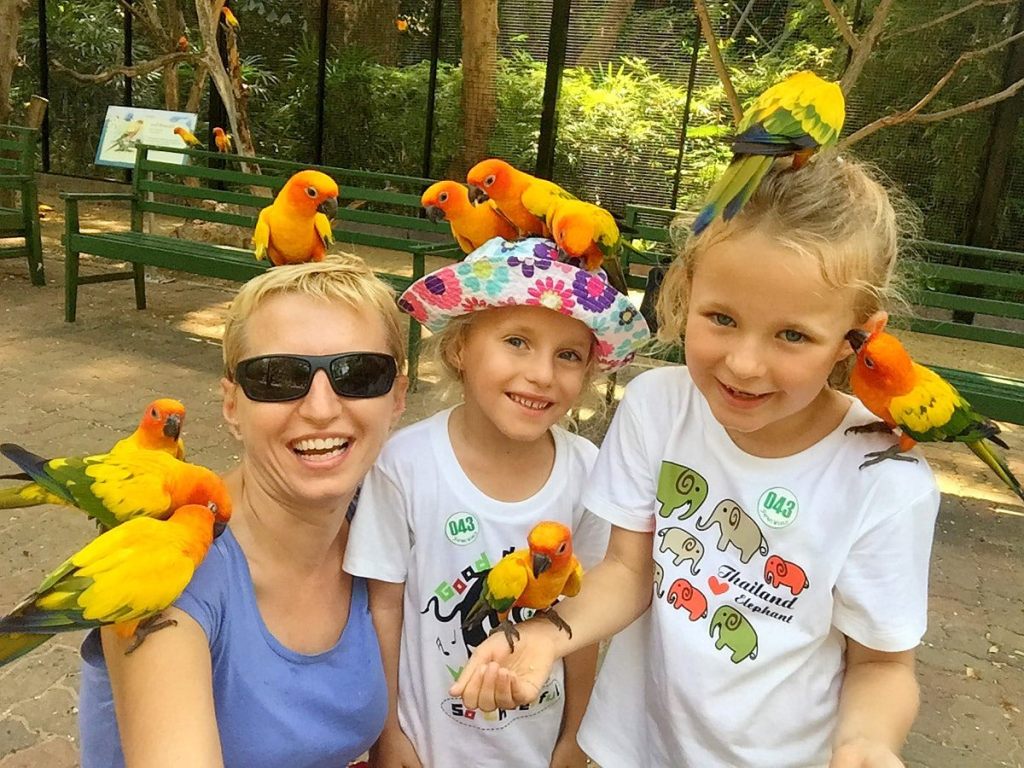 A mom and her 2 little daughters hanging out at the Safari World Bangkok