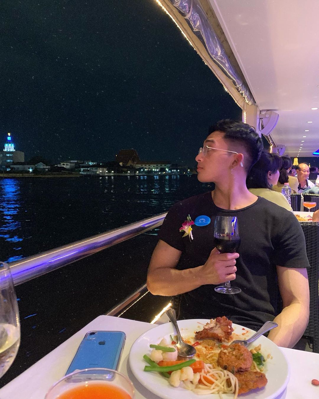 A cruise passenger enjoying his dinner on Chao Phraya River