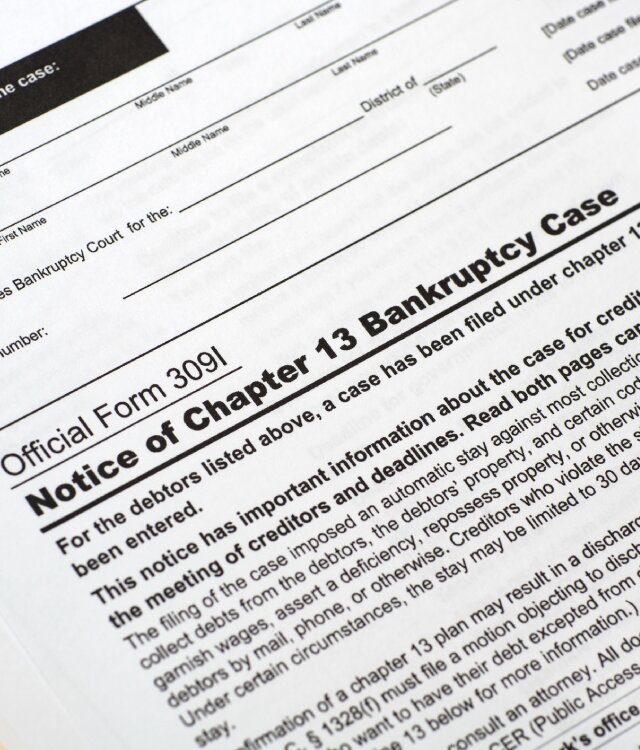 Image of lawyer helping to plan bankruptcy filing for client